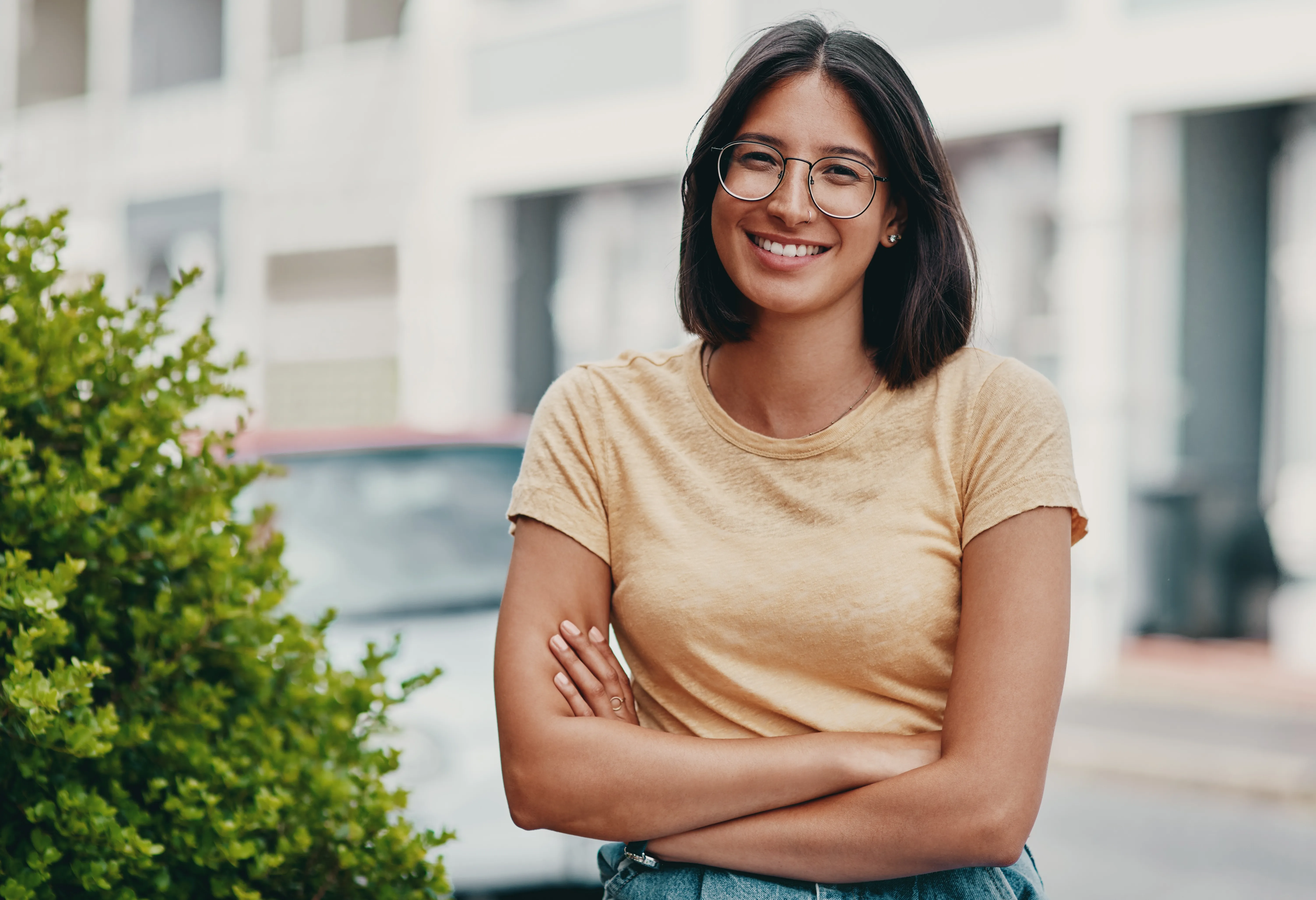 A smiling woman in a light-filled home